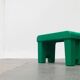 Postmodern plastic stool with a wood effect.
