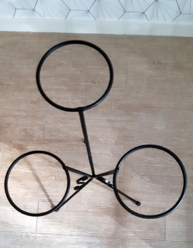 Plant holder in black wrought iron.