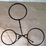 Plant holder in black wrought iron.