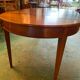 Louis XVI style oval walnut extendable table
