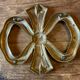 Brass knot table mat