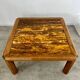 Old coffee table with golden marble top, 70s design, vintage wooden feet