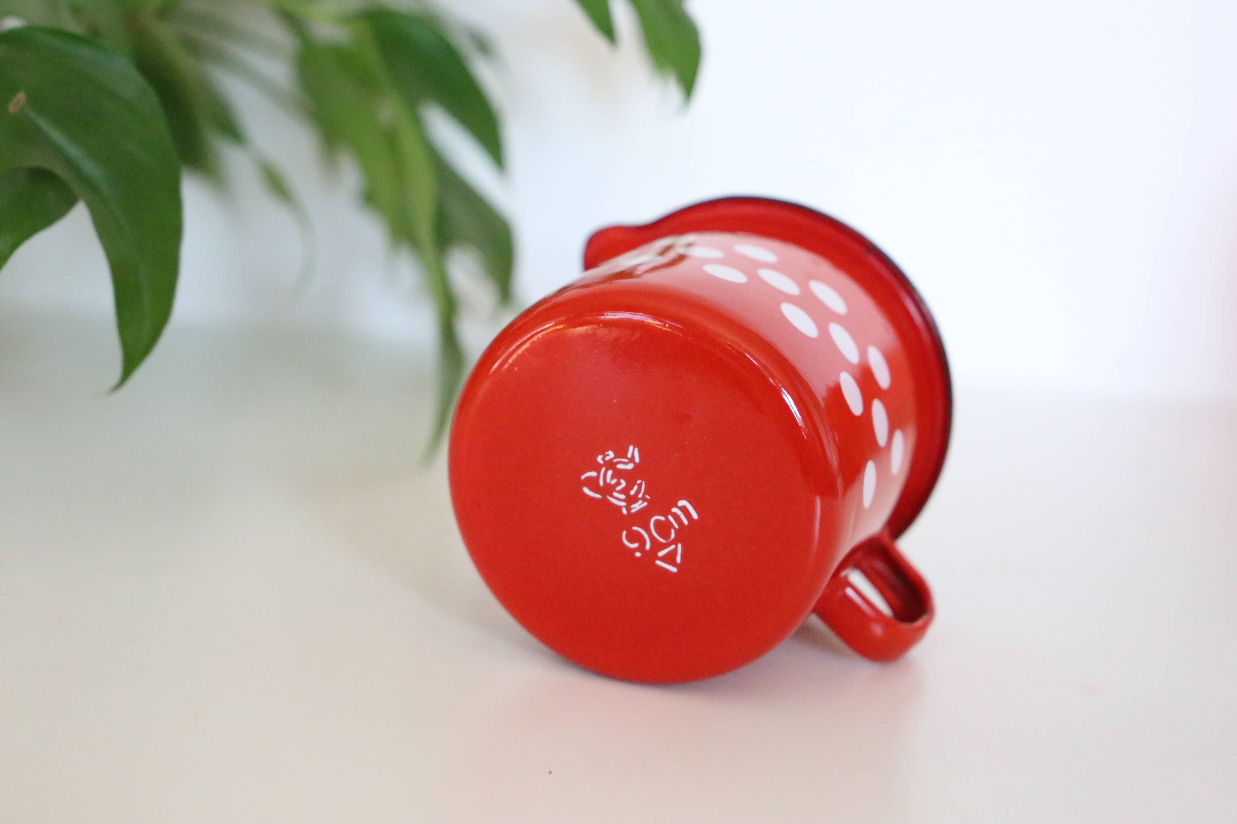 Red enamelled metal milk pot