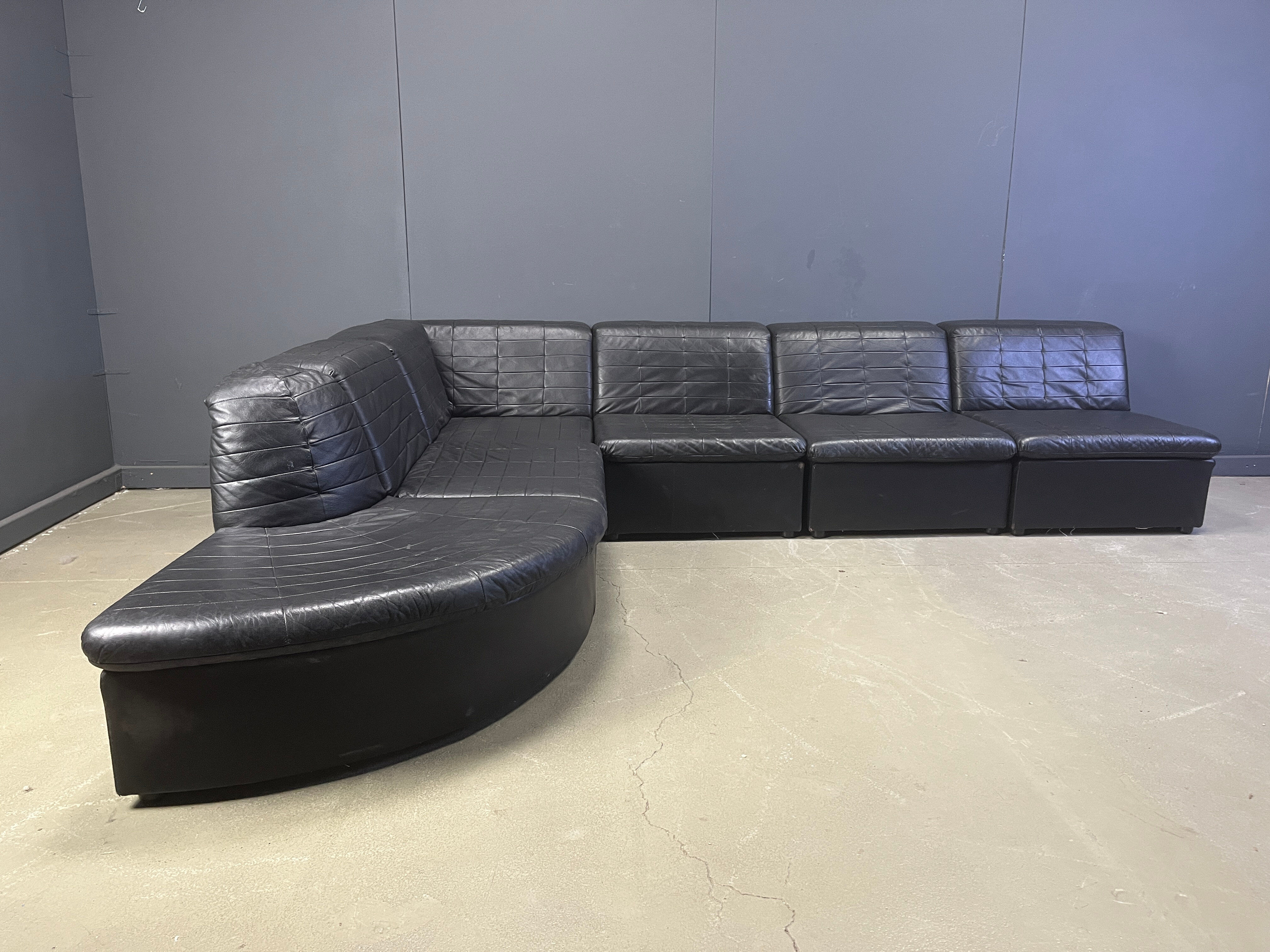Vintage black patchwork leather modular sofa set by Laauser, 1970s