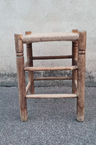Vintage handmade wooden stool and rope