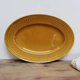 Serving dish in mustard gien earthenware