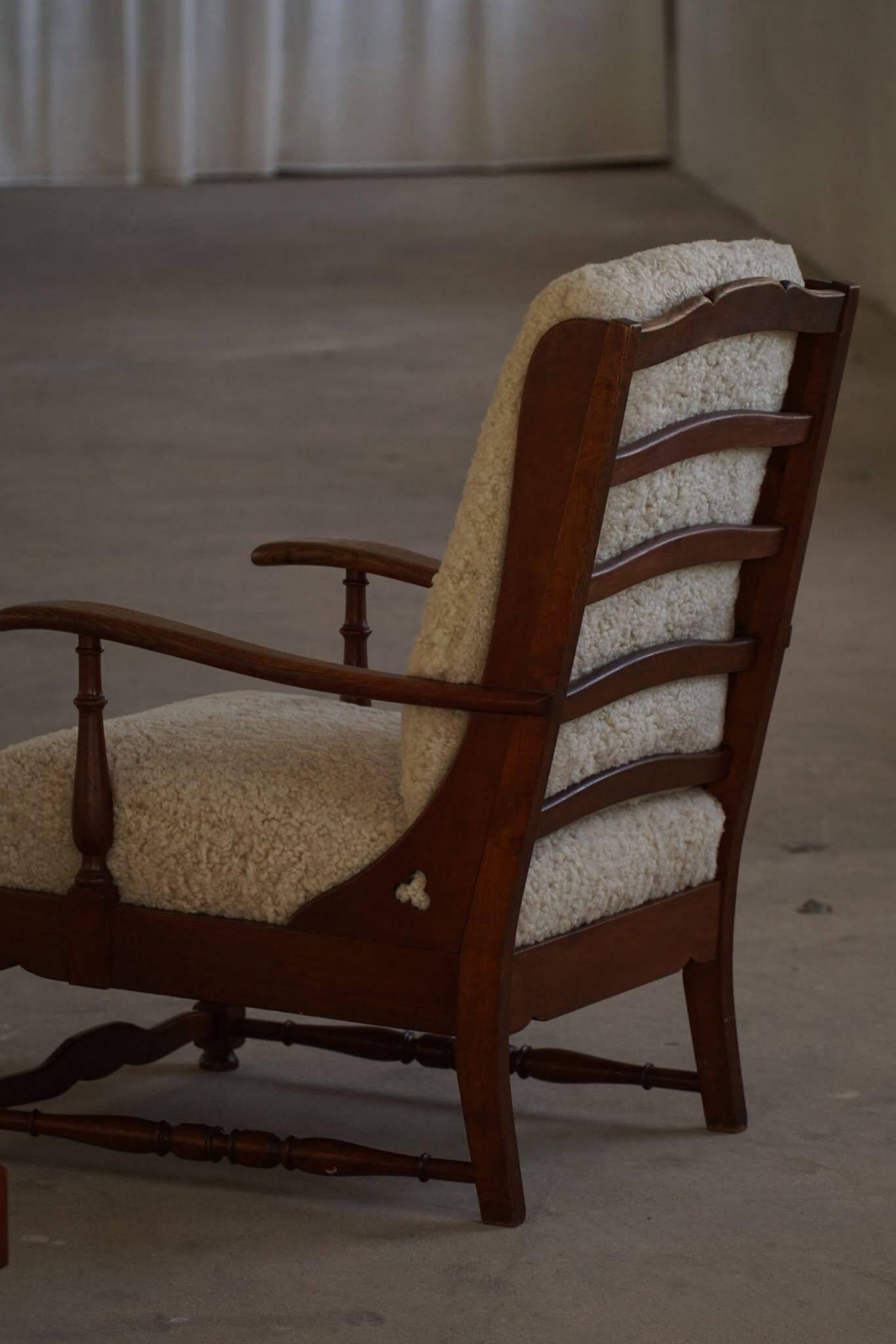 Modern Danish design, a pair of high-backed armchairs in oak and lambswool, 1950s.