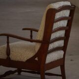 Modern Danish design, a pair of high-backed armchairs in oak and lambswool, 1950s.