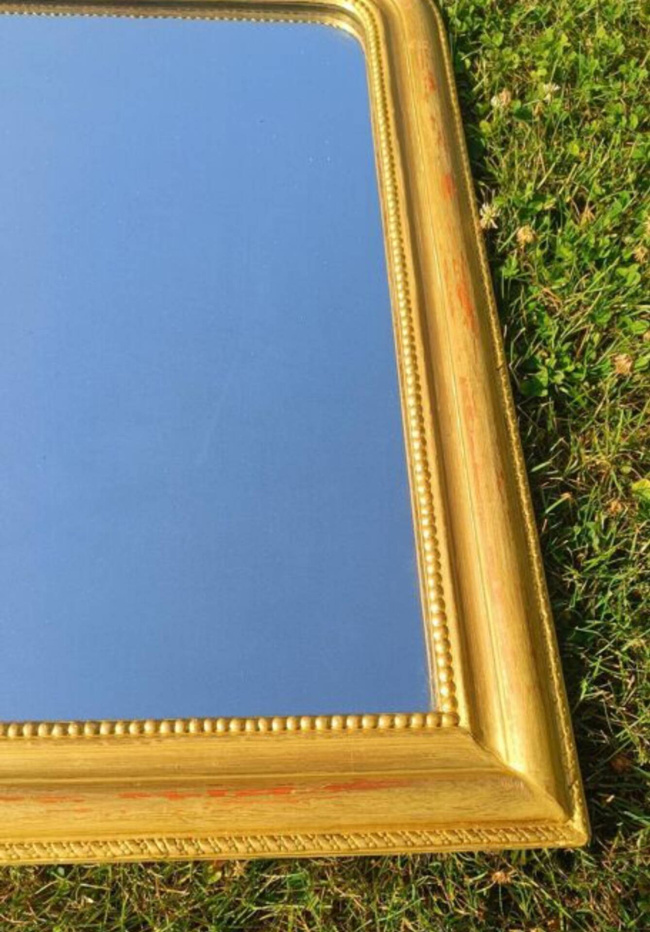 Antique Louis-Philippe mirror, gilded and patinated.