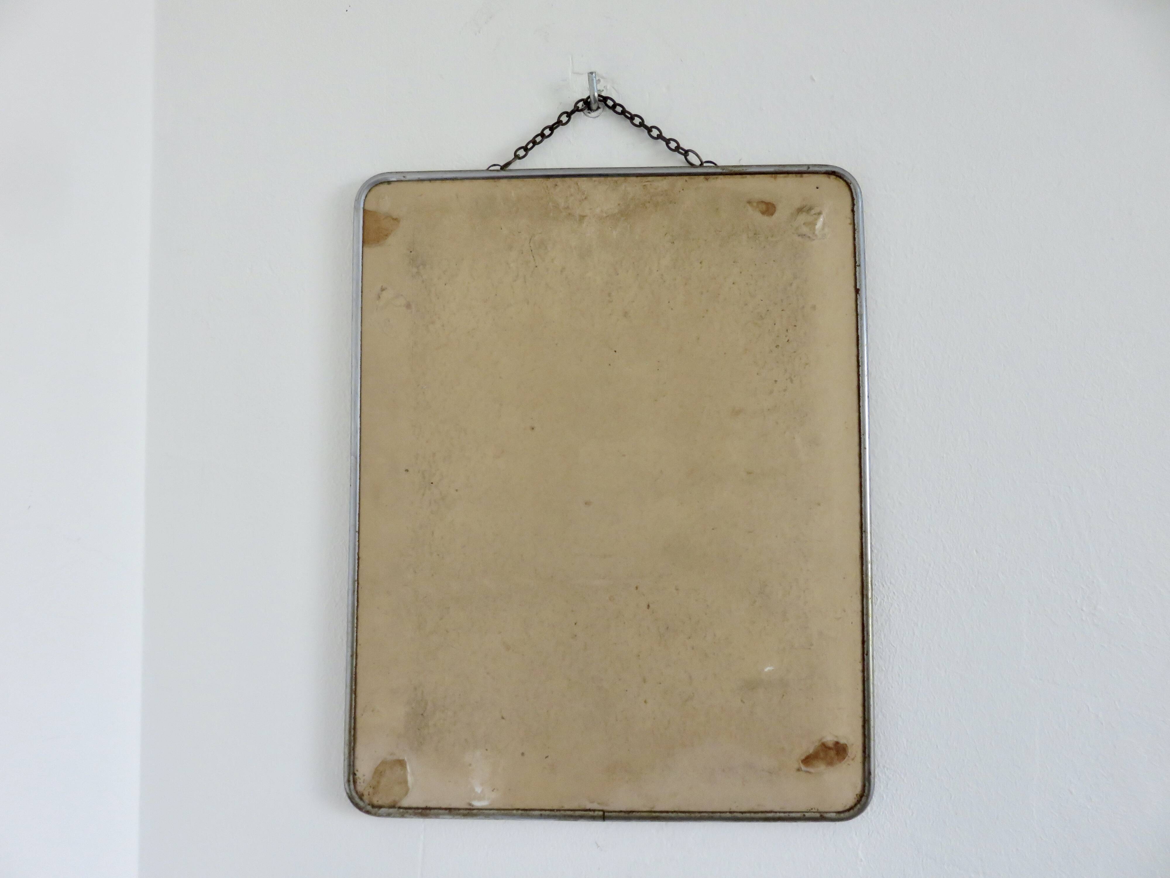 Old barber's mirror with chain, 1950s and 1960s
