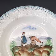 Large antique hollow dish from the 19th century, earthenware with pastoral decoration featuring a child, pig, and goose.