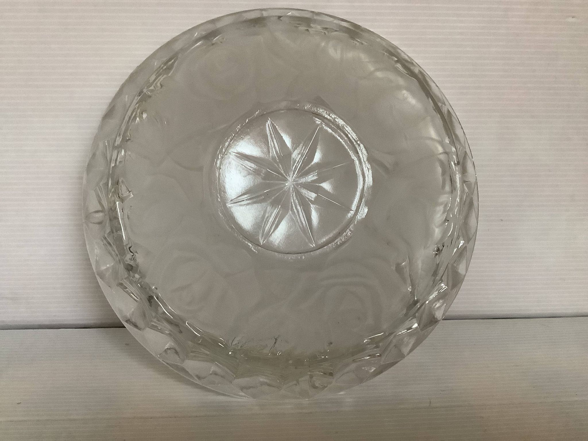 Large glass ashtray with frosted flowers.