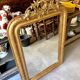 Gold sculpted and moulded stucco trumeau mirror 113 x 78 cm