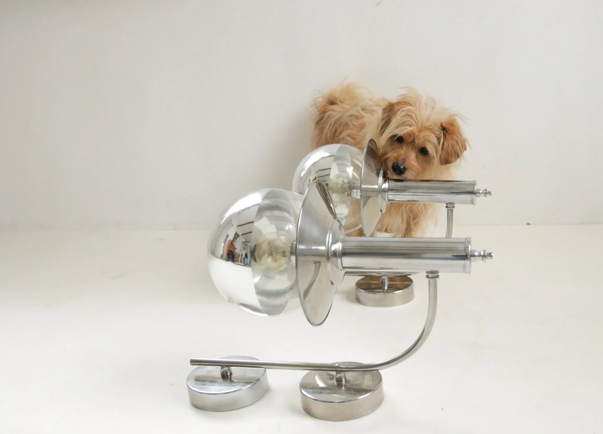 Pair of European mid-century chrome wall sconces with mirrored globe shades