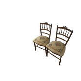 Pairs of floral fabric chairs for the ladies of France.