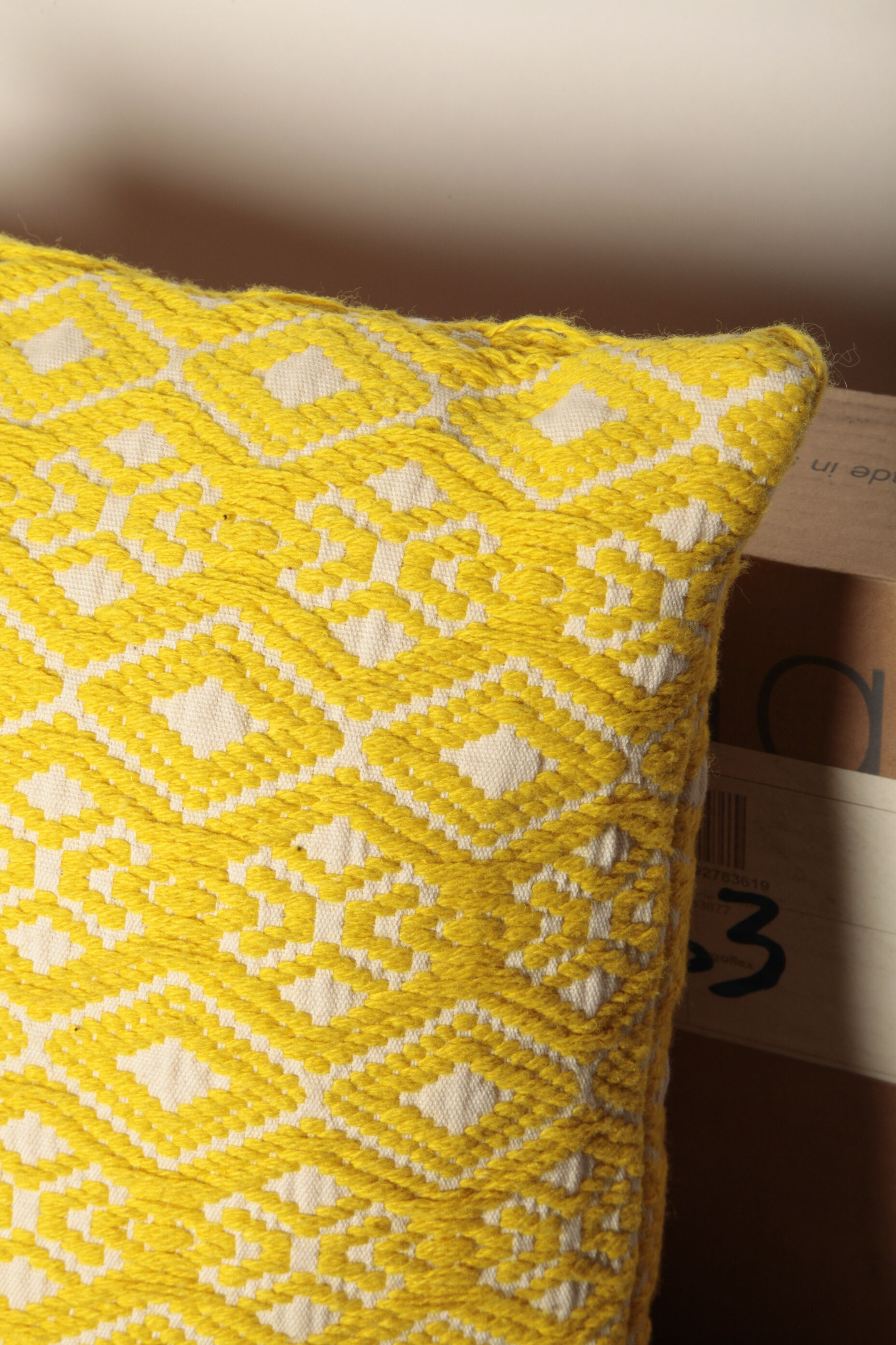 Yellow diamond knit cushion