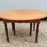 6-foot oval table with caramel patina extensions