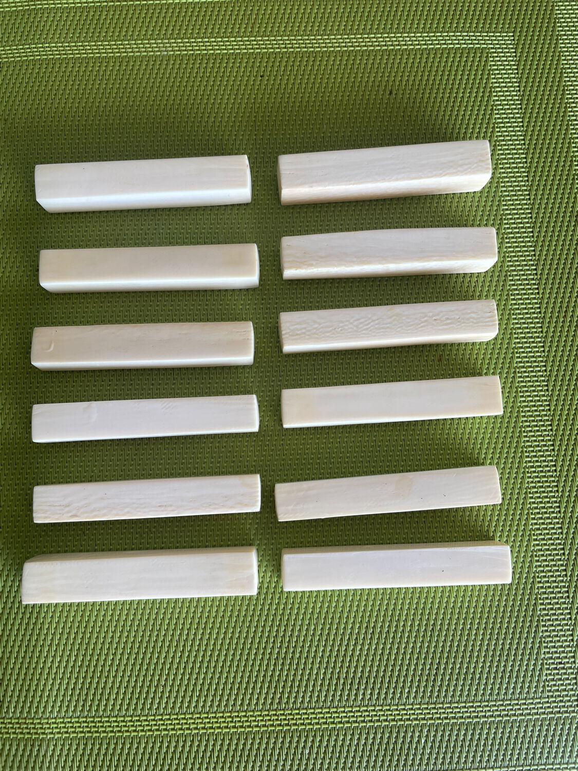 Set of 12 vintage knife rests in polished bone - ivory look, minimal