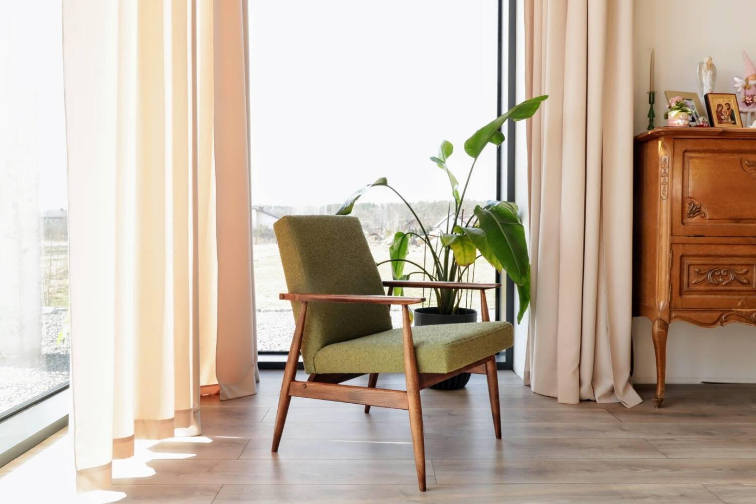 Mid-century modern armchair in olive green bouclé design by H. Lis.