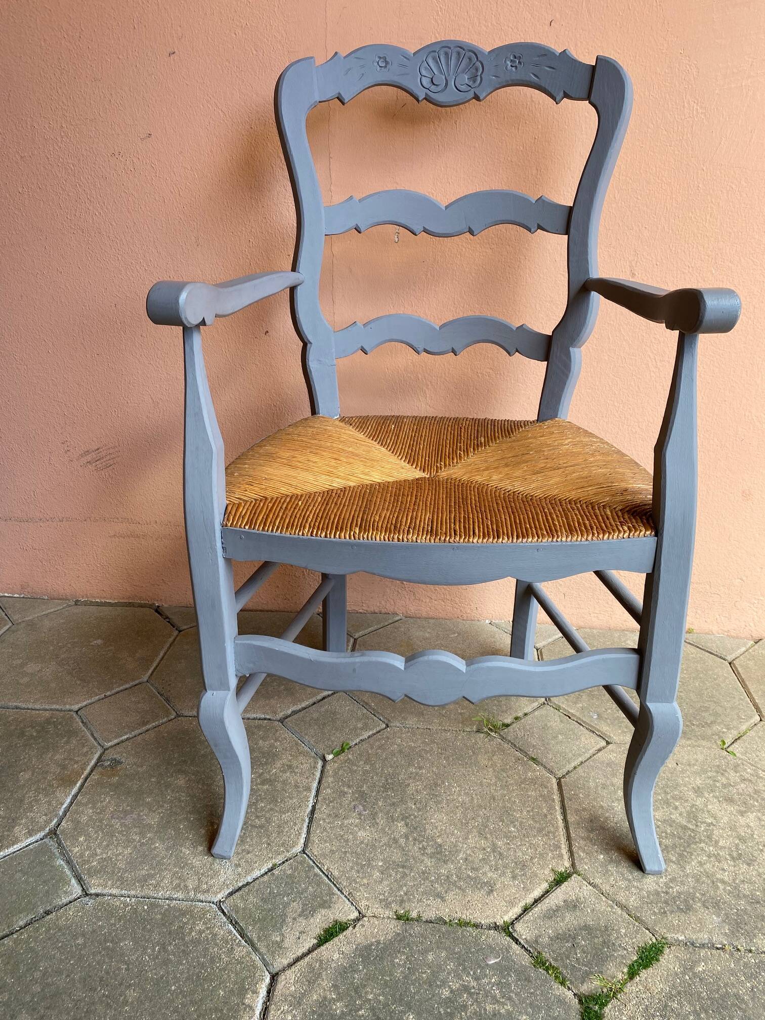 Provencal style straw armchair with gray blue patina armrests