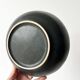 Round vintage black ceramic catchall.