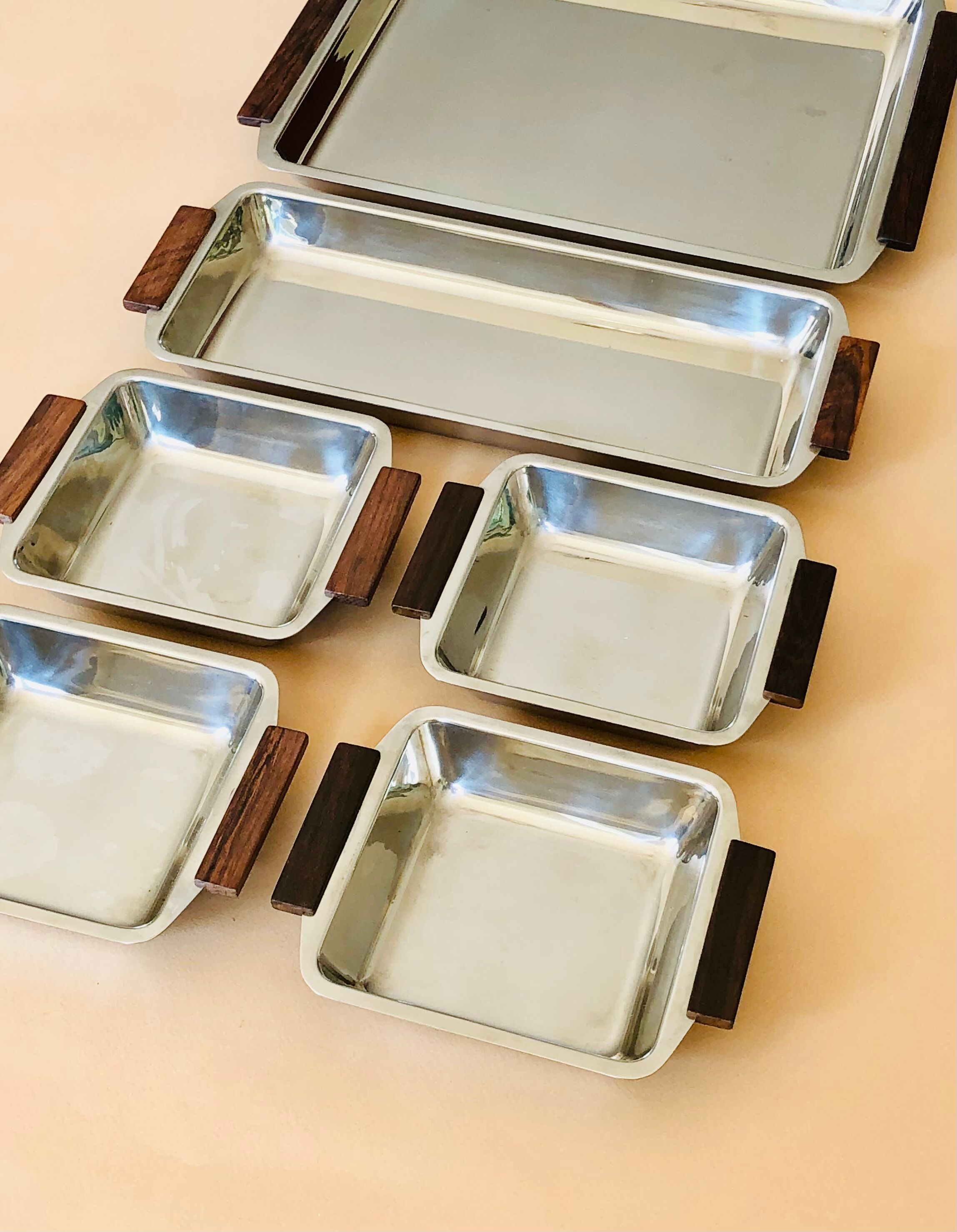 Service of Scandinavian dishes in stainless steel and teak 1970