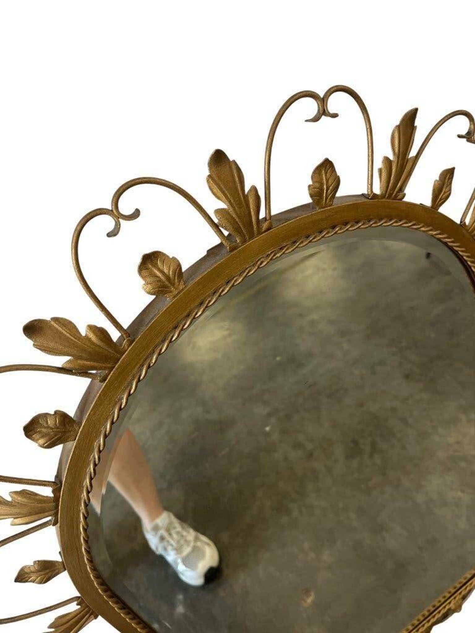 Vintage gold wall mirror with leaves
