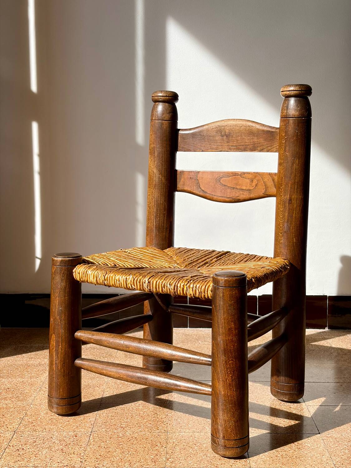 Low fireplace chair attributed to Charles Dudouyt.