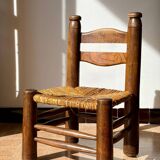 Low fireplace chair attributed to Charles Dudouyt.