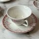 Set of 5 cups and saucers Sarreguemines with red rose decoration.