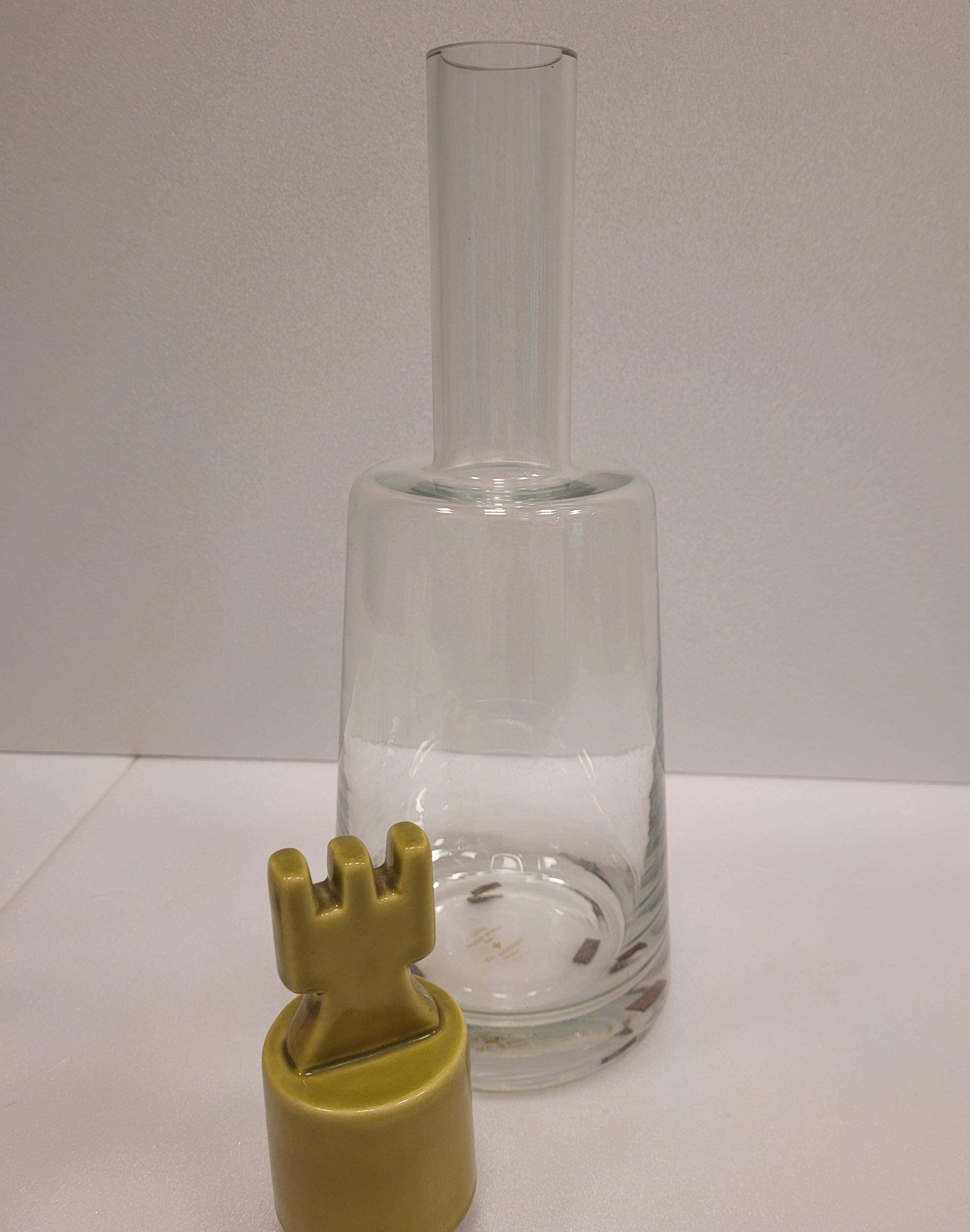 pair of decanters, bottles or jars, made in crystal with a ceramic tap enameled in green color