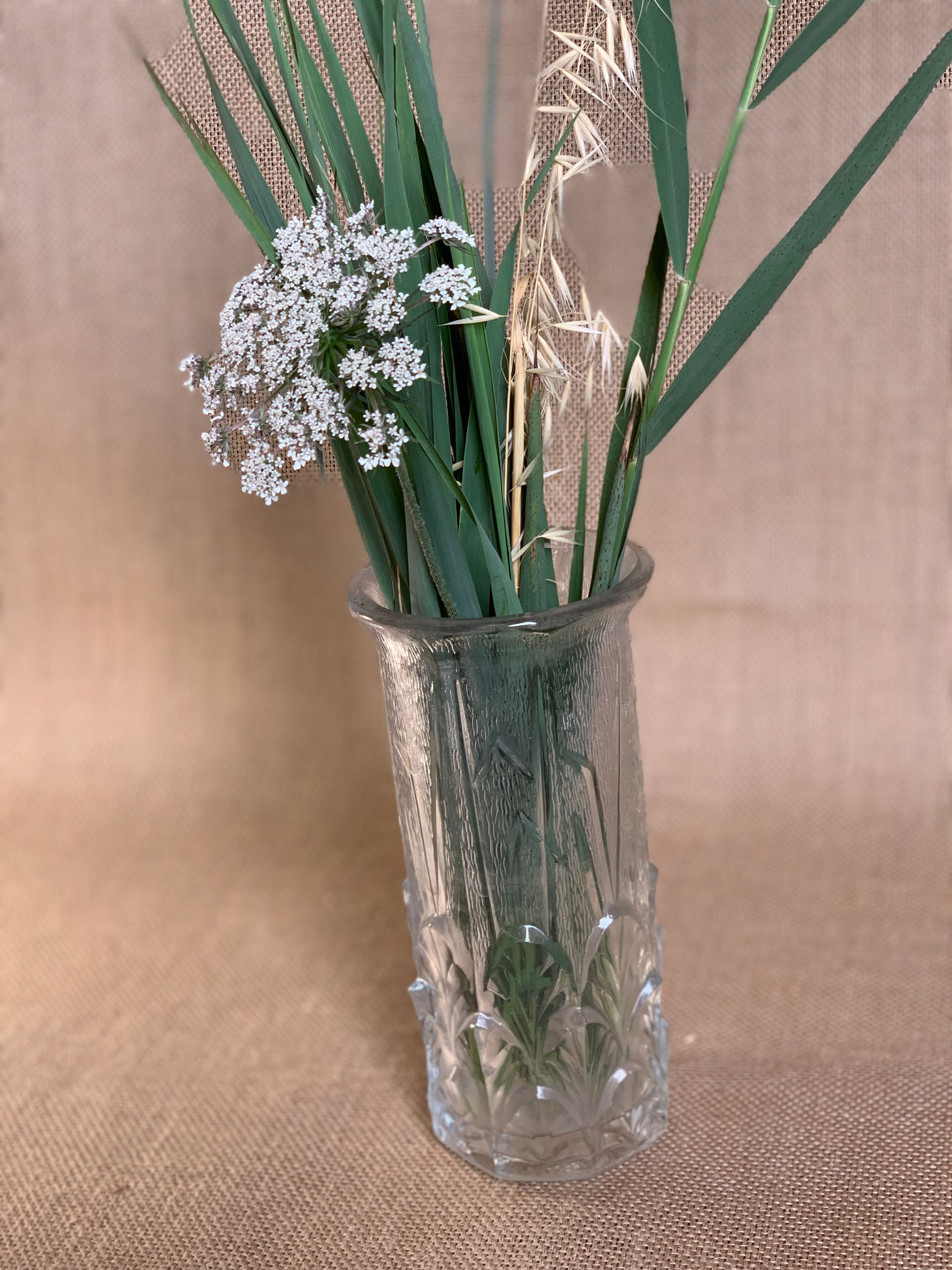 Old cylindrical vase in 40s style in thick glass