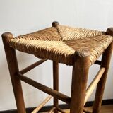Low wooden and straw stool