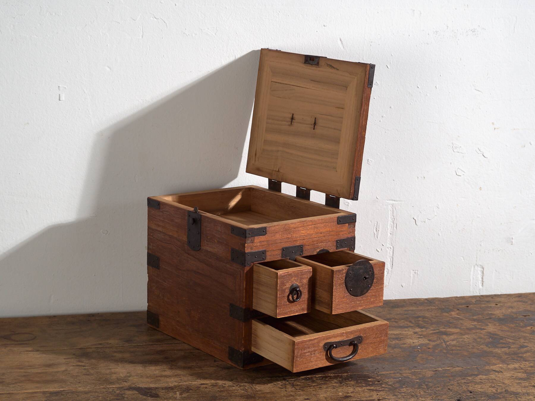 Japanese ko-dansu with hinged lid and paulownia wood drawers, Meiji–Taishō period, circa 1868–1926.