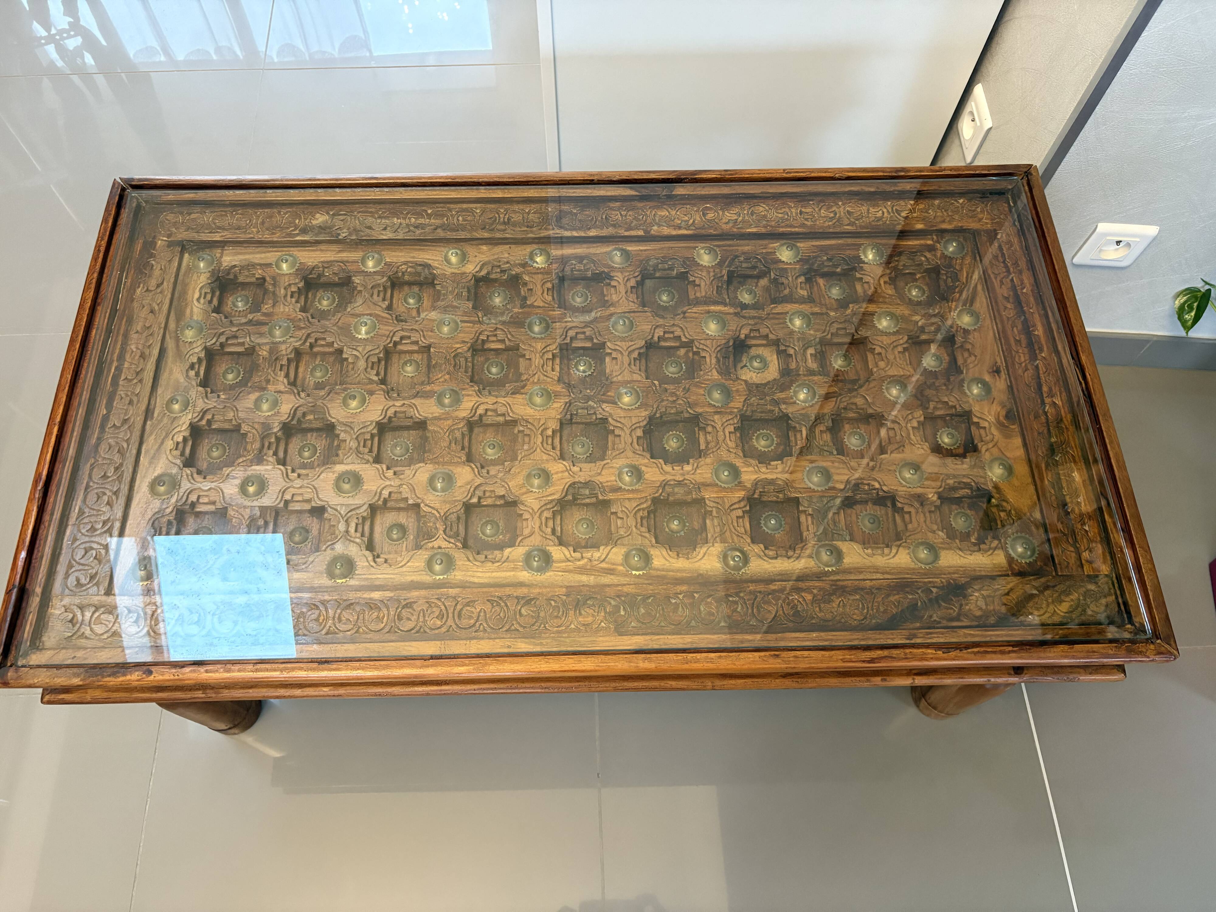 Solid oak carved coffee table with glass top