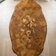 Oval coffee table in walnut burl wood.