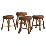 A set of 4 vintage Scandinavian rattan stools, in the style of Tony Paul, from the 1960s.