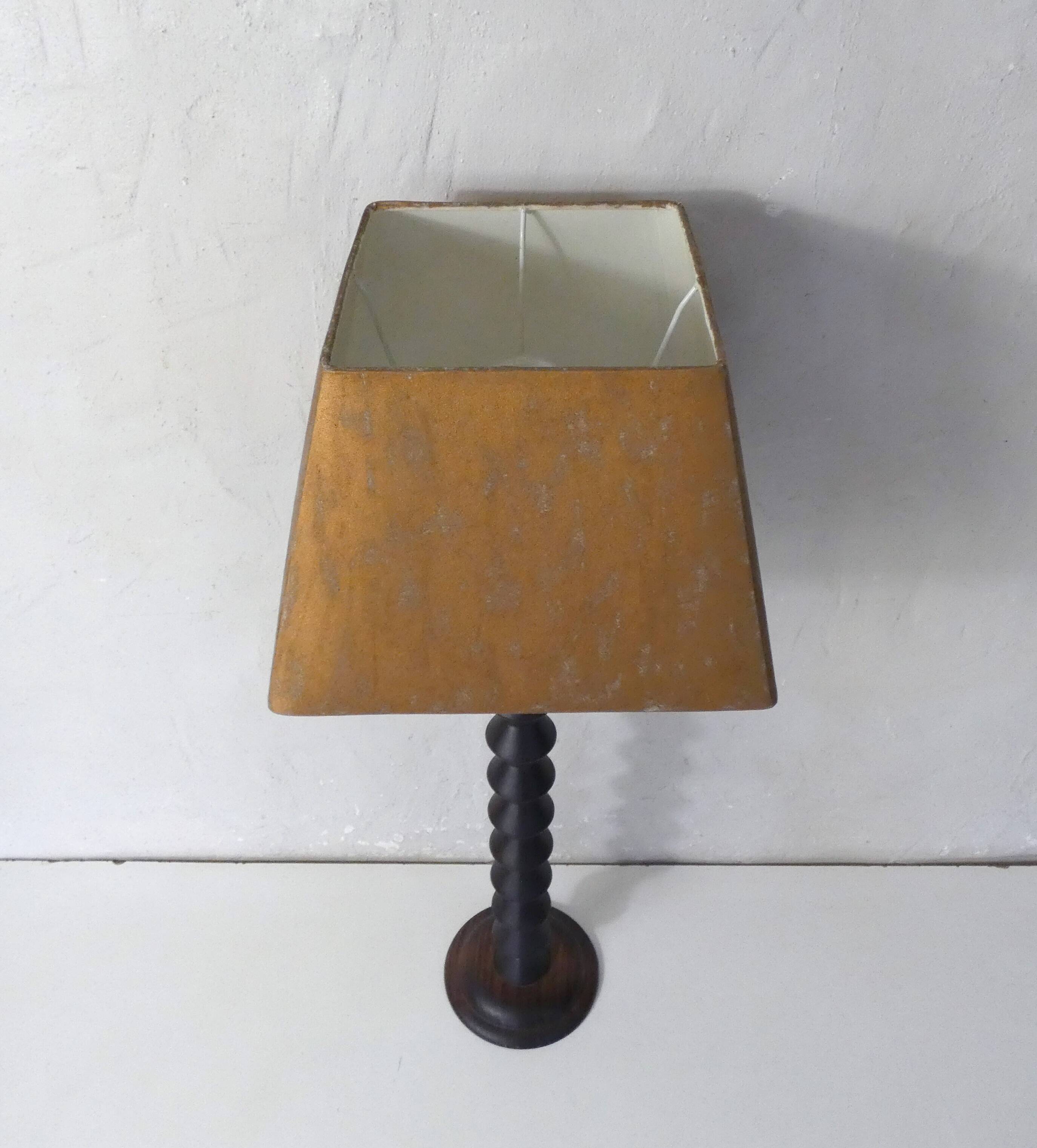 turned wooden lamp with spool base and vintage copper shade