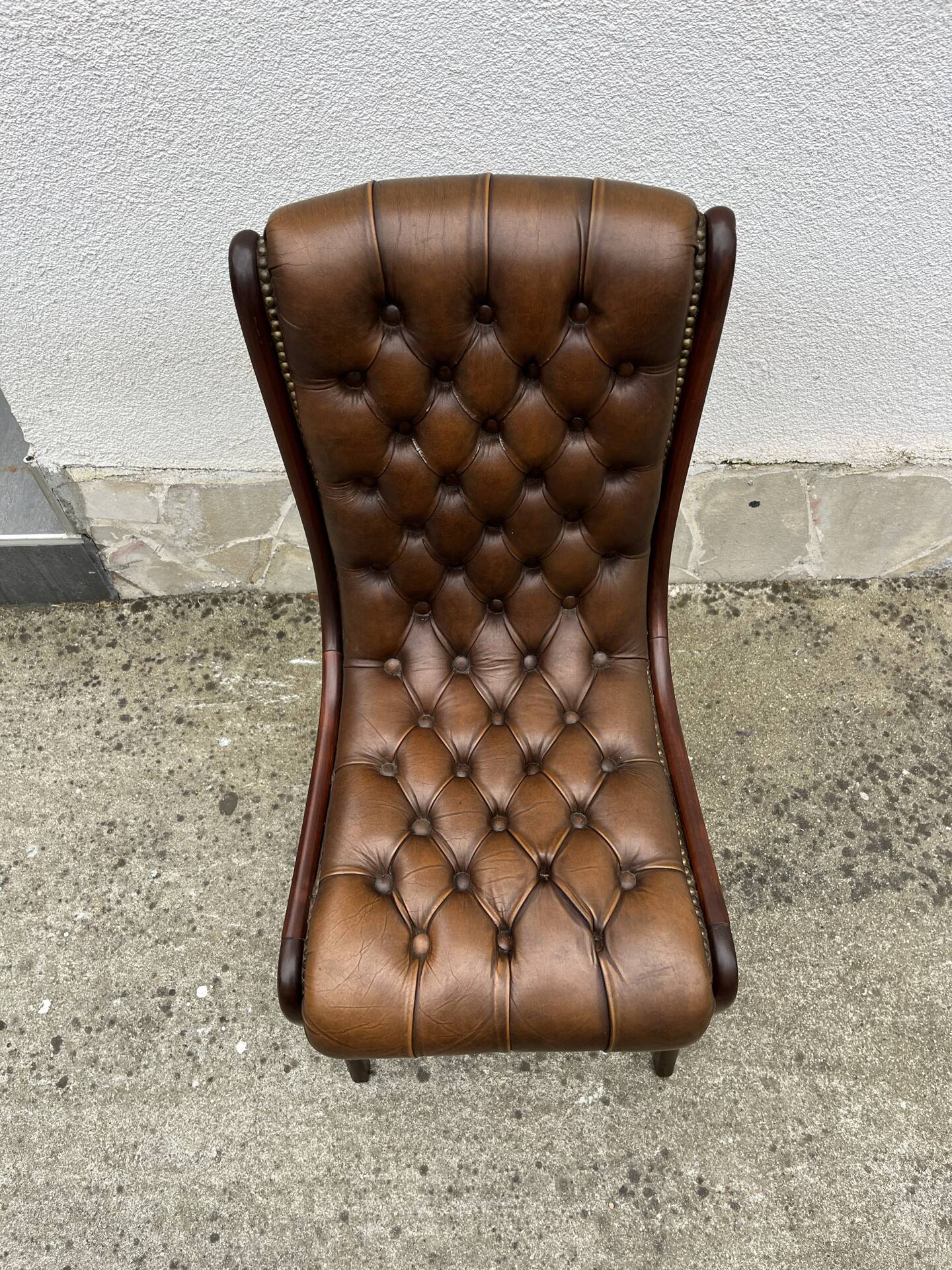 Brown leather tufted Chesterfield chair