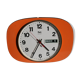 Vintage wall clock in orange formica