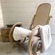 Rocking chair with a cane seat and backrest.