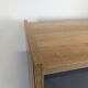 Modernist sideboard with glass doors in grey and yellow oak veneer.