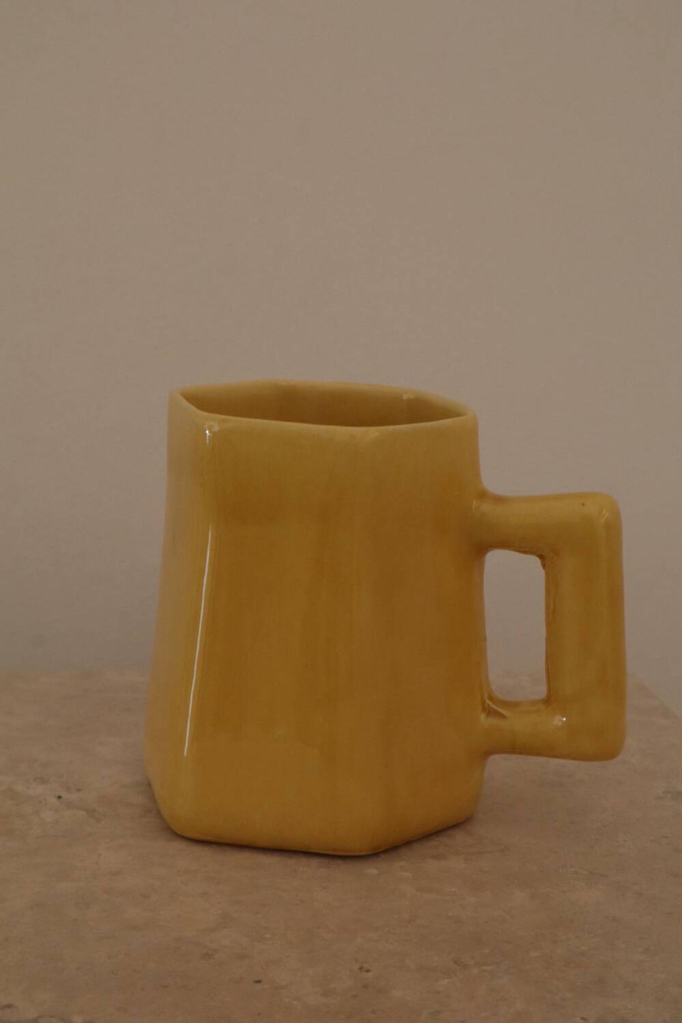 Set of two designer lemon yellow ceramic mugs