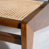 Reclined armchair in canned teak in natural wood