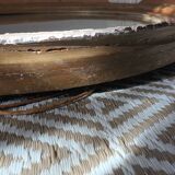 Antique oval gilded stucco mirror