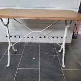 Bistro table with cast iron base and oak top