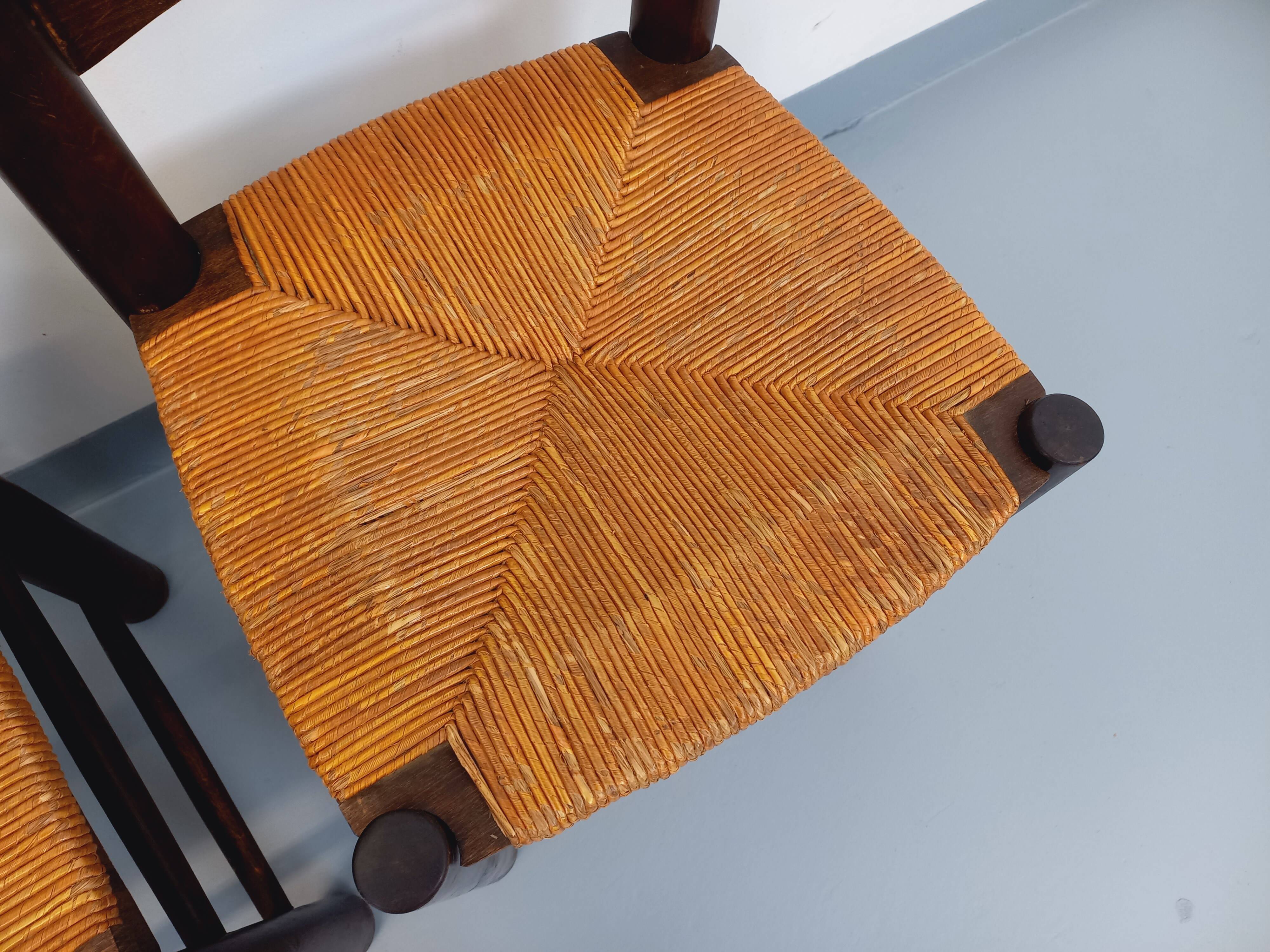Set of 4 vintage brutalist chairs by Georges Robert in wood and straw.