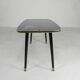 Vintage coffee table with glass top and angled legs