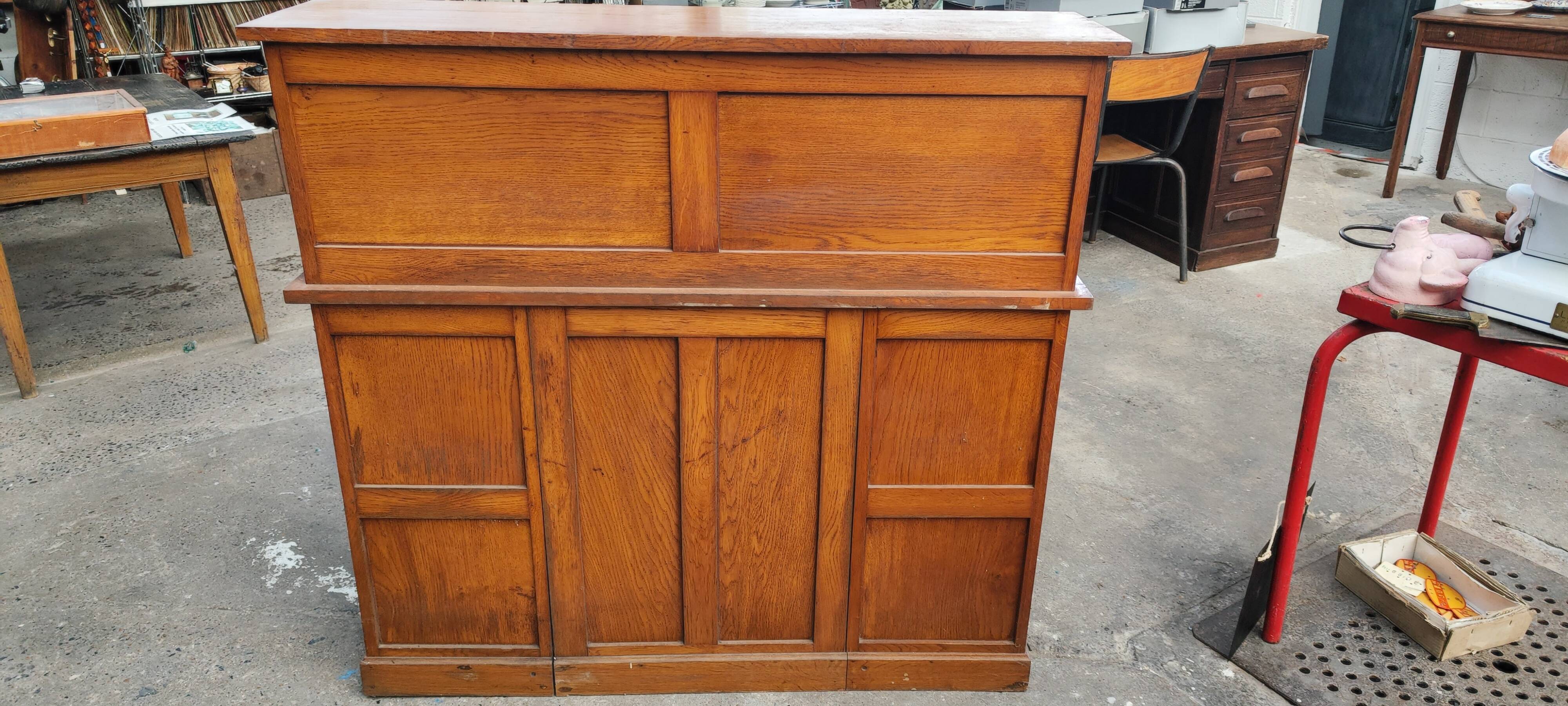 Old American desk in solid oak with S-shaped shutter
