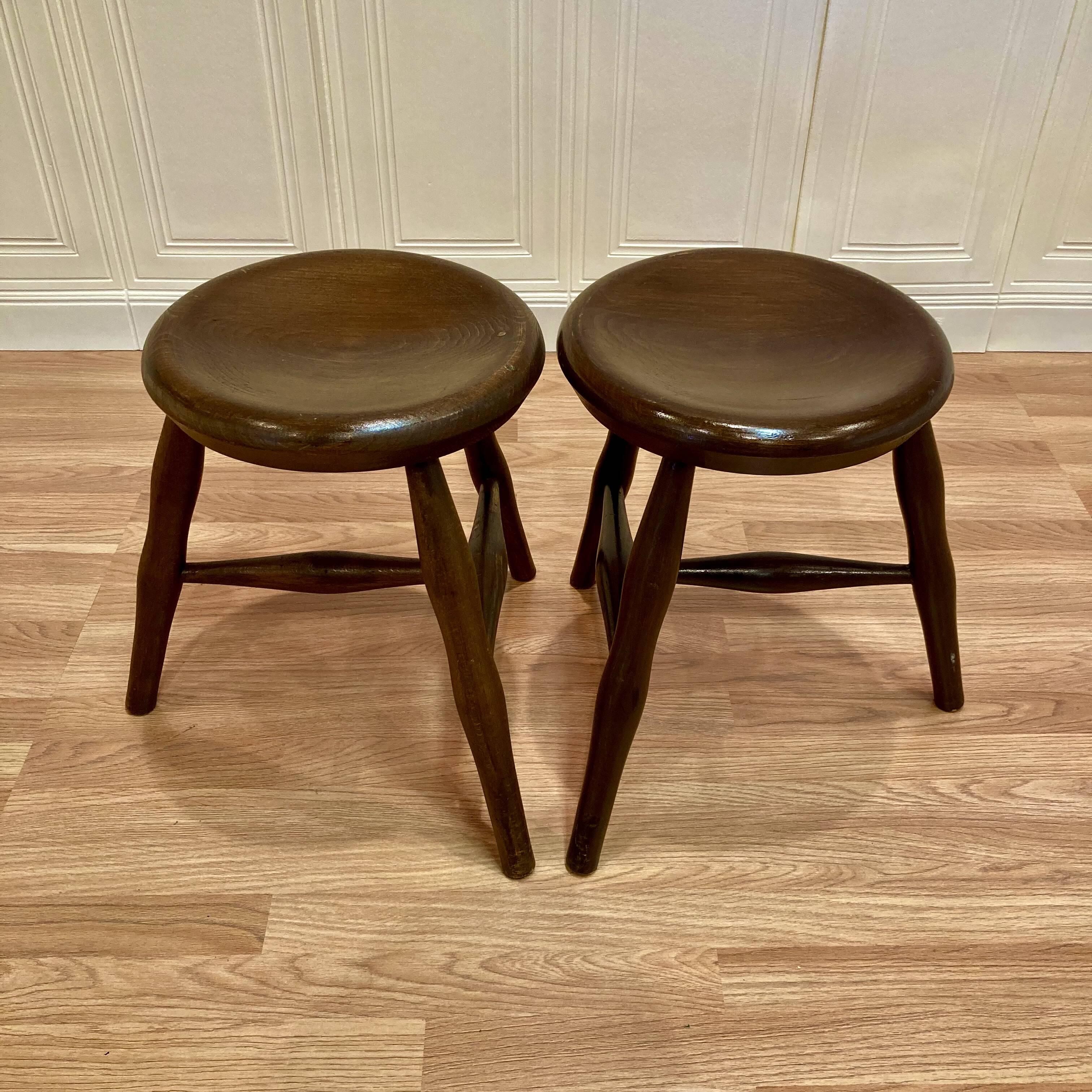A pair of tripod stools from the period.